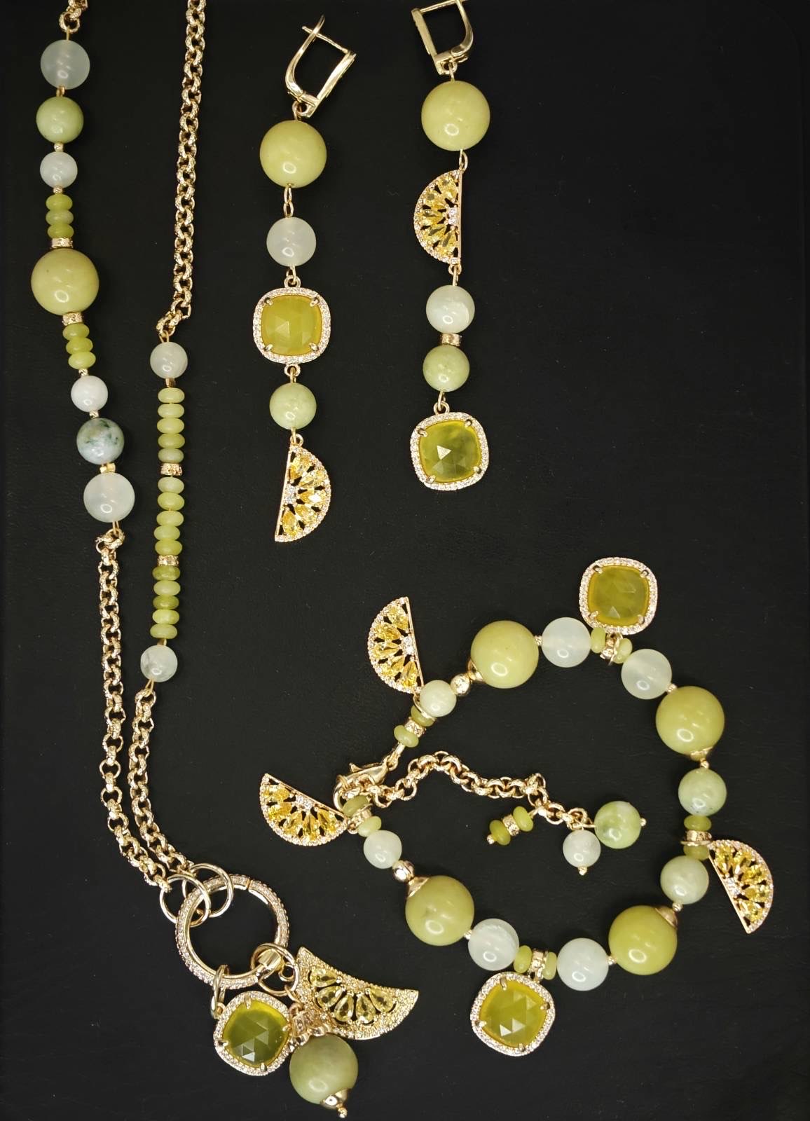 Verdant Light necklace, bracelet and earrings arranged together