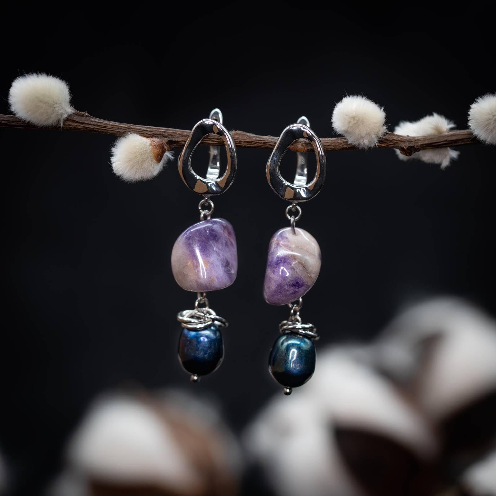Willow Dusk earrings hanging from a willow branch